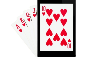 A Royal Flush in hearts. The 10 is shown on a smartphone screen. The Royal Flush is the top hand in video poker.