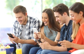young people playing on their phones
