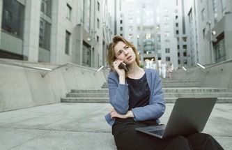 a gamer on her phone looking confused and puzzled