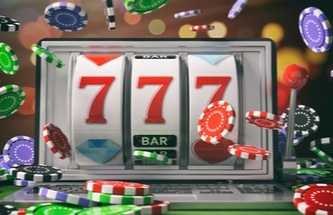 A slot game on a laptop with chips flying around