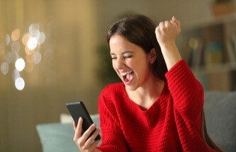 woman in red sweater winning playing multi-hand video poker at Everygame Casino