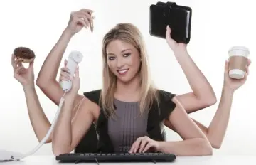 a young businesswoman with seemingly six arms doing several actions at the same time. In a word, multitasking.