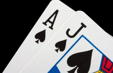 close up of a blackjack with oversized ace and jack of spades