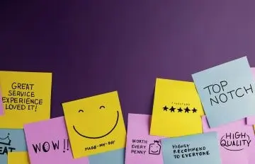 many colored post-its with positive comments about a company such as wow, high quality, great service, and highly recommended