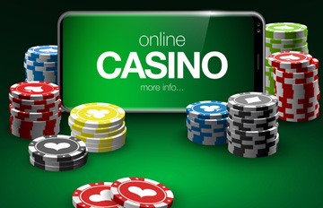 picture of a mobile casino on a phone with poker chips surrounding the phone sitting on a poker table