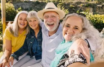 group of middle aged friends having fun together taking a selfie