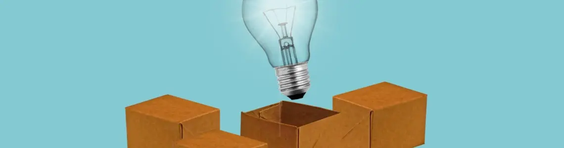 a light bulb coming out of a box indicating thinking outside the box