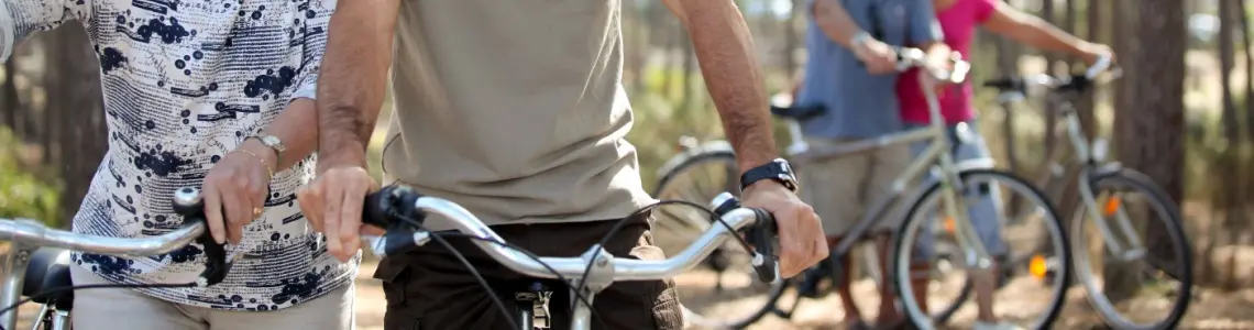 two older couples bicycling together