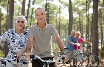 two older couples bicycling together