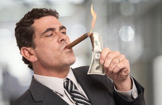 man lighting his cigar with money