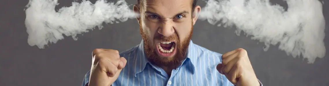 a bearded young man very angry with steam coming out of his ears