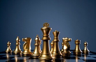 beautiful chess set on a game board signifying games of skill