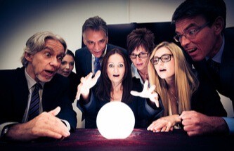a group of people looking into a crystal ball