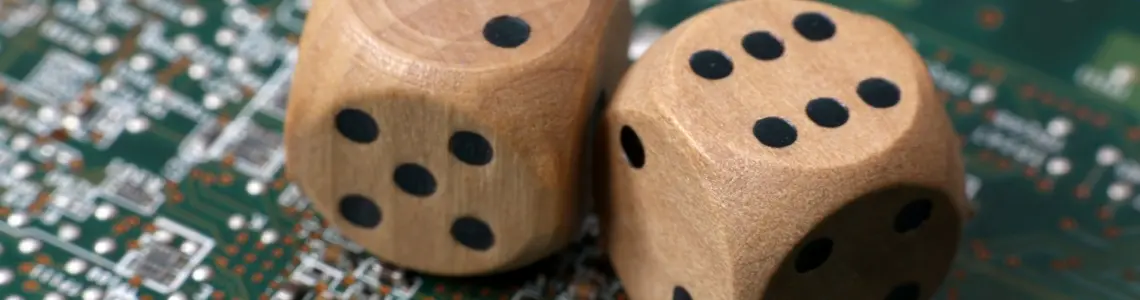 two wooden die on top of a computer mother board showing random numbers to exemplify the idea of the random number generator