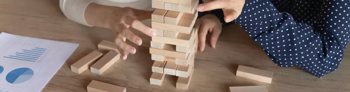 two women playing Jenga