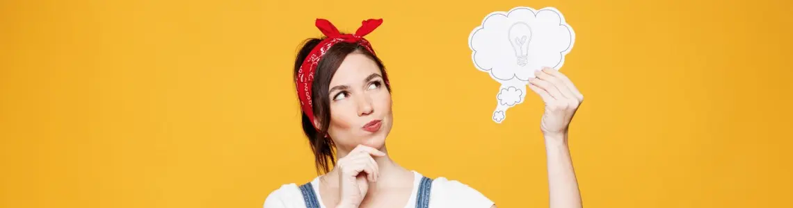 a young handywoman in overalls with a red bandana on her head 