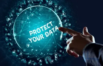 a man pointing to a blue sign that seems like a solar system of data that he is trying to protect